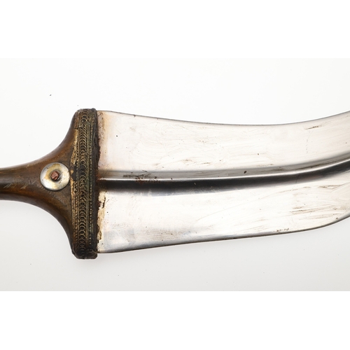 63 - A YEMENI JANABI KNIFE AND SCABBARD ON THE ORIGINAL BROAD BELT. The knife with a 22 cm curved blade w... 