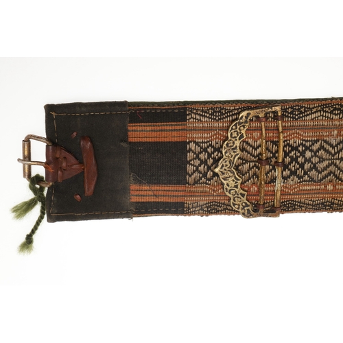 63 - A YEMENI JANABI KNIFE AND SCABBARD ON THE ORIGINAL BROAD BELT. The knife with a 22 cm curved blade w... 