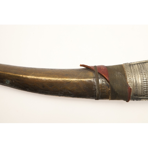 64 - A FINE LONG BLADED JANBIYYA AND SCABBARD. A Janbiyya having a 37 cm curved blade with shallow fuller... 