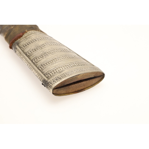 64 - A FINE LONG BLADED JANBIYYA AND SCABBARD. A Janbiyya having a 37 cm curved blade with shallow fuller... 