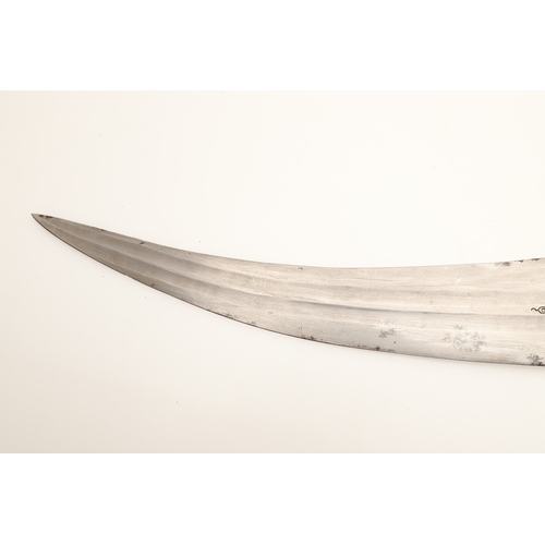 64 - A FINE LONG BLADED JANBIYYA AND SCABBARD. A Janbiyya having a 37 cm curved blade with shallow fuller... 