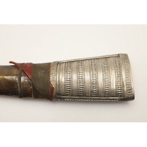 64 - A FINE LONG BLADED JANBIYYA AND SCABBARD. A Janbiyya having a 37 cm curved blade with shallow fuller... 