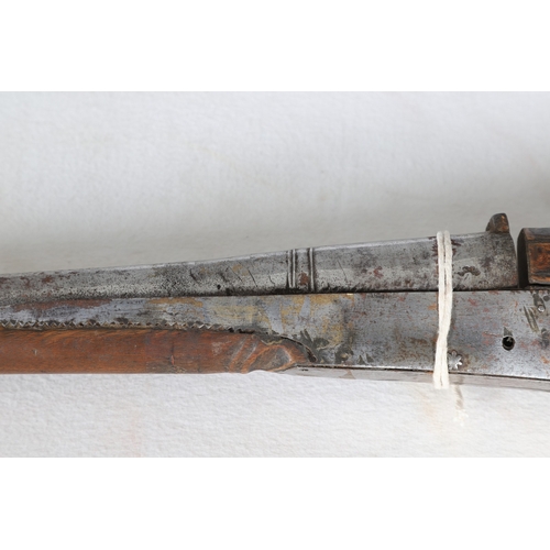 7 - AN INDIAN MATCHLOCK LONG GUN. The 105 cm long barrel, tapering towards the slightly flared muzzle. F... 