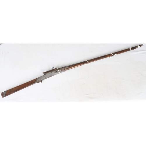 7 - AN INDIAN MATCHLOCK LONG GUN. The 105 cm long barrel, tapering towards the slightly flared muzzle. F... 