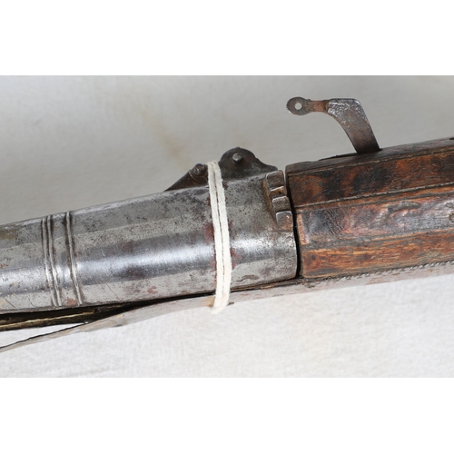 7 - AN INDIAN MATCHLOCK LONG GUN. The 105 cm long barrel, tapering towards the slightly flared muzzle. F... 