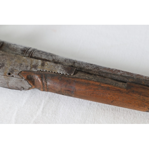 7 - AN INDIAN MATCHLOCK LONG GUN. The 105 cm long barrel, tapering towards the slightly flared muzzle. F... 