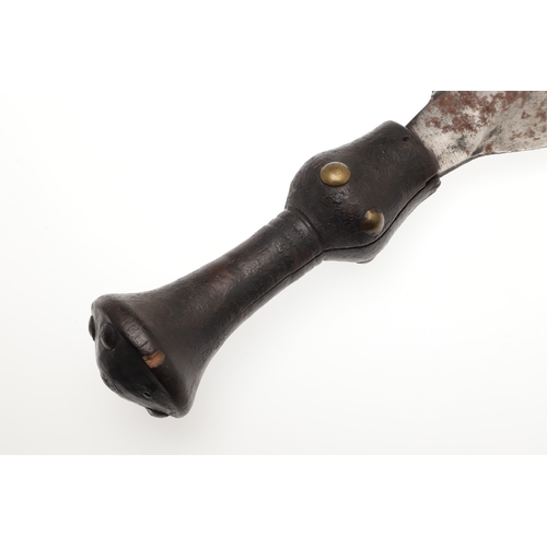 89 - A LKULA KUBA CLUB KNIFE. The 22 cm club form blade with pronounced central spine, on a short wooden ... 