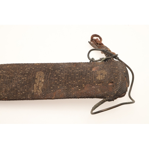 91 - A FANG KNIFE AND SCABBARD. A knife with a 40 cm pointed, spear shaped blade with central ridge, twin... 