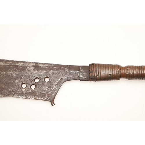 92 - A TROMBASH THROWING KNIFE OF THE MANGEBUTI PEOPLE. The blade 27 x 19 cm of a pronounced hook form, w... 