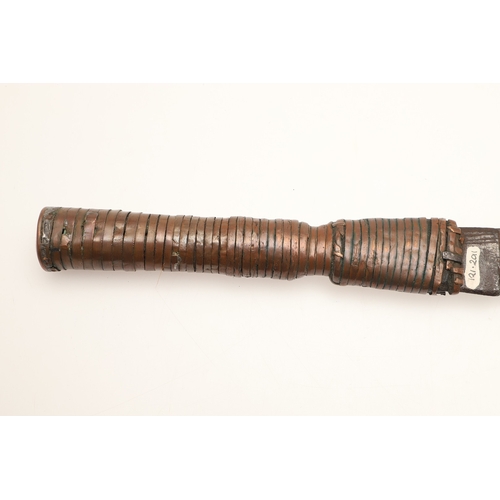 92 - A TROMBASH THROWING KNIFE OF THE MANGEBUTI PEOPLE. The blade 27 x 19 cm of a pronounced hook form, w... 