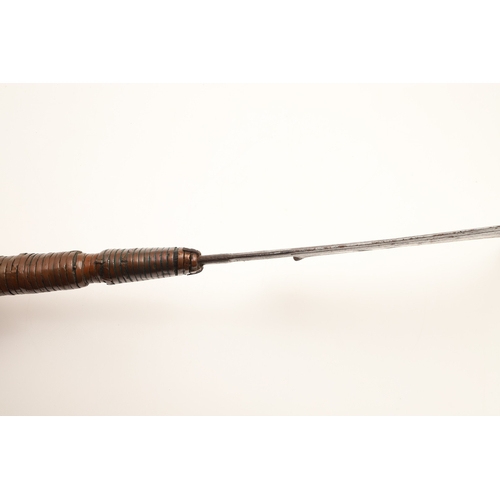 92 - A TROMBASH THROWING KNIFE OF THE MANGEBUTI PEOPLE. The blade 27 x 19 cm of a pronounced hook form, w... 