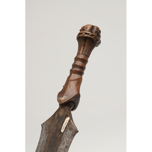 99 - A SALAMPASU KNIFE AND SCABBARD FROM SOUTHERN ZAIRE. The 45 cm blade of irregular outline with pointe... 