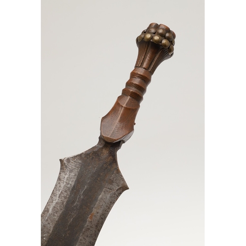 99 - A SALAMPASU KNIFE AND SCABBARD FROM SOUTHERN ZAIRE. The 45 cm blade of irregular outline with pointe... 
