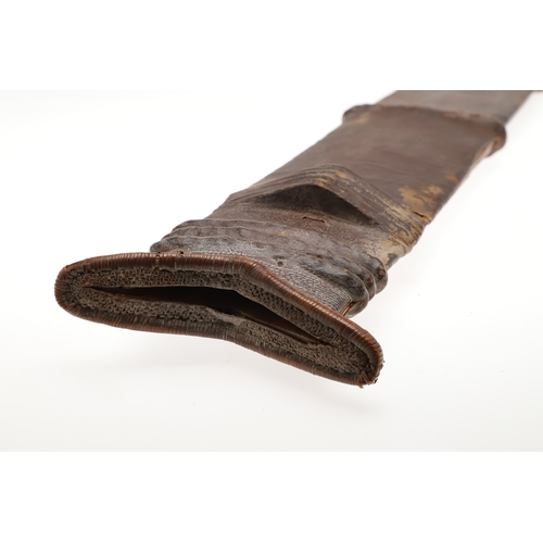 99 - A SALAMPASU KNIFE AND SCABBARD FROM SOUTHERN ZAIRE. The 45 cm blade of irregular outline with pointe... 