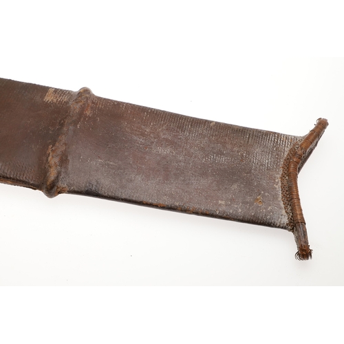 99 - A SALAMPASU KNIFE AND SCABBARD FROM SOUTHERN ZAIRE. The 45 cm blade of irregular outline with pointe... 