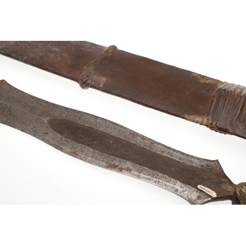 99 - A SALAMPASU KNIFE AND SCABBARD FROM SOUTHERN ZAIRE. The 45 cm blade of irregular outline with pointe... 