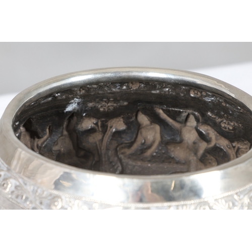 100 - A LATE 19TH / EARLY 20TH CENTURY BURMESE RICE BOWL. The sides with continuous repousse panel of figu... 