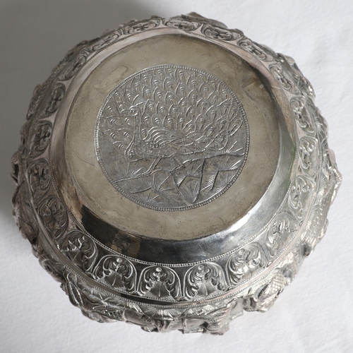 100 - A LATE 19TH / EARLY 20TH CENTURY BURMESE RICE BOWL. The sides with continuous repousse panel of figu... 