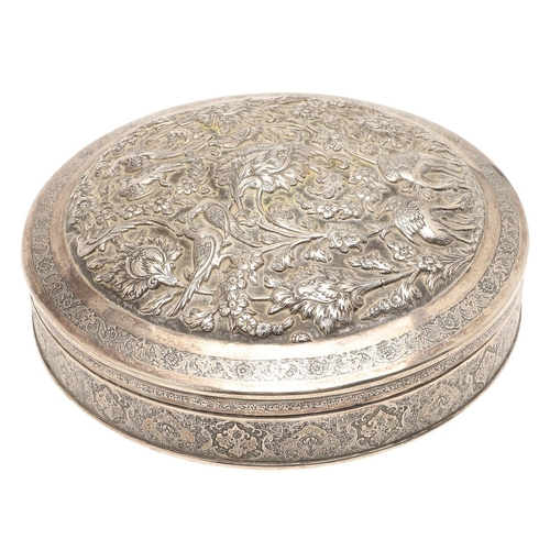 105 - A PERSIAN 875 SILVER BOX. Circular shape, the lid repoussé decorated cranes amongst trailing flowers... 