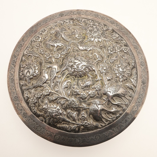 105 - A PERSIAN 875 SILVER BOX. Circular shape, the lid repoussé decorated cranes amongst trailing flowers... 