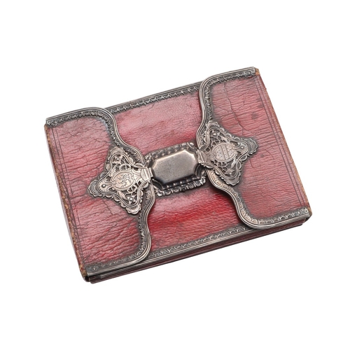 107 - AN EIGHTEENTH CENTURY SILVER MOUNTED WALLET. of red morocco leather with pierced silver mounts and l... 
