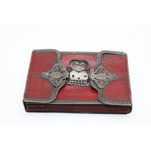 107 - AN EIGHTEENTH CENTURY SILVER MOUNTED WALLET. of red morocco leather with pierced silver mounts and l... 