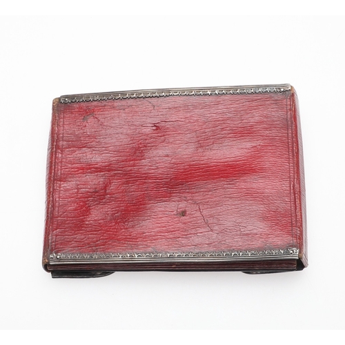 107 - AN EIGHTEENTH CENTURY SILVER MOUNTED WALLET. of red morocco leather with pierced silver mounts and l... 