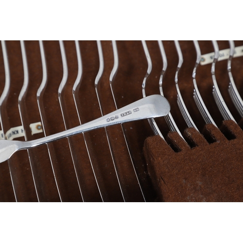 18 - A GEORGE V CANTEEN OF SILVER FLATWARE. Old English pattern, crested a rampant lion holding a halberd... 