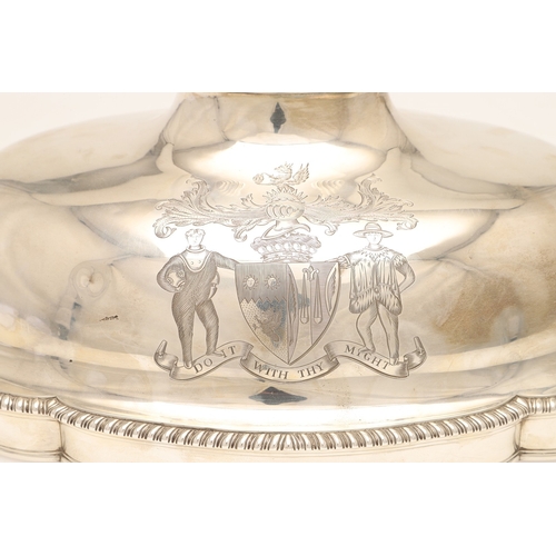 25 - A GEORGE III CRESTED SILVER MEAT DISH COVER. Of shaped-serpentine form, with gadrooned rim, engraved... 