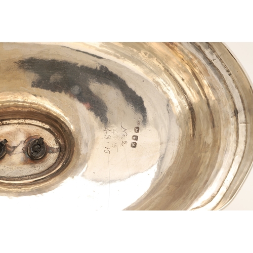 25 - A GEORGE III CRESTED SILVER MEAT DISH COVER. Of shaped-serpentine form, with gadrooned rim, engraved... 