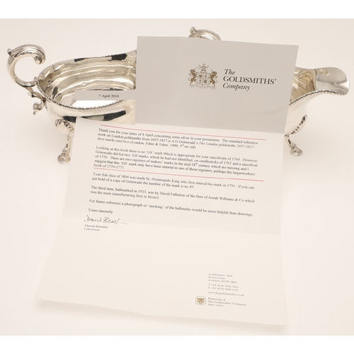 26 - A PAIR OF GEORGE III SILVER SAUCE BOATS. Each one featuring a heavy gadrooned border and scroll hand... 