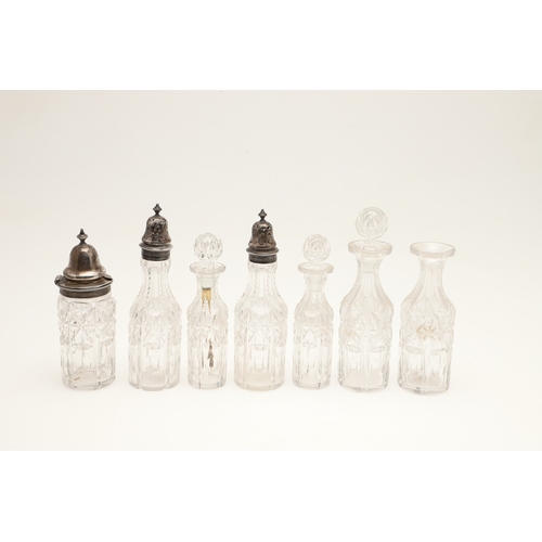 27 - A VICTORIAN SILVER SEVEN PIECE CRUET SET ON STAND. The stand with beaded border, pierced and engrave... 