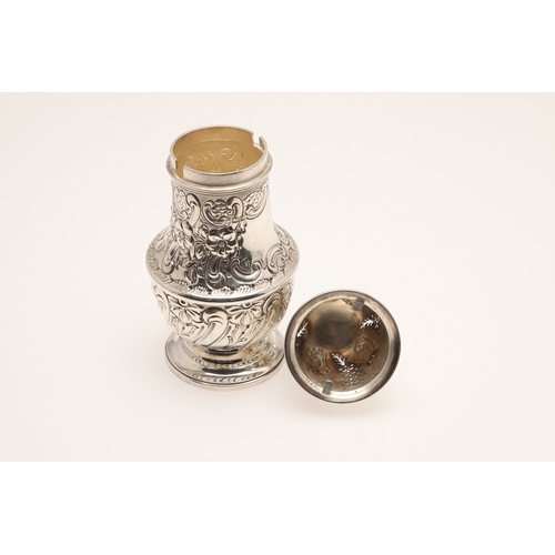 33 - A LARGE EDWARDIAN BALUSTER CASTER. On a spreading foot, the body embossed with floral and foliate de... 