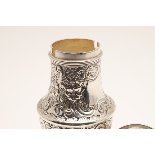 33 - A LARGE EDWARDIAN BALUSTER CASTER. On a spreading foot, the body embossed with floral and foliate de... 