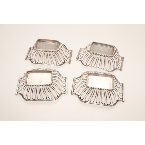 40 - A SET OF FOUR EDWARDIAN SILVER BON BON DISHES. Of shaped rectangular form with wirework style decora... 