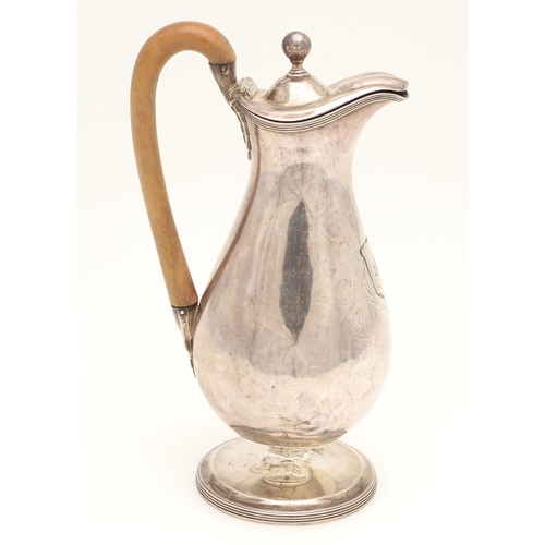 46 - A GEORGE III SILVER HOT WATER JUG. The lid with ball finial, the wooden handle with foliate decorate... 