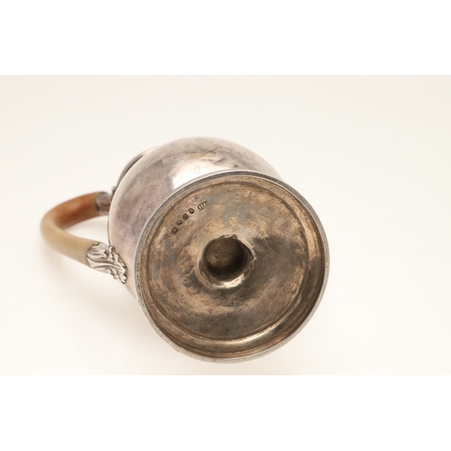 46 - A GEORGE III SILVER HOT WATER JUG. The lid with ball finial, the wooden handle with foliate decorate... 