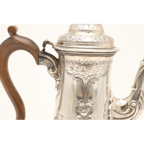 47 - AN EARLY GEORGE III SILVER COFFEE POT. With chased floral and foliate decoration, scroll handle and ... 