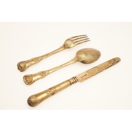 5 - A GEORGE IV SILVER GILT KINGS PATTERN KNIFE, FORK AND SPOON SET. The fork and spoon hallmarked WC, L... 