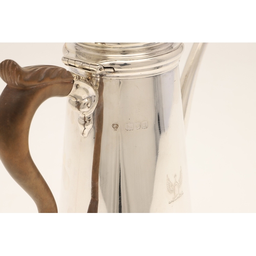 50 - A LATE VICTORIAN SILVER COFFEE POT. Of circular tapering form with carved fruitwood scroll handle an... 