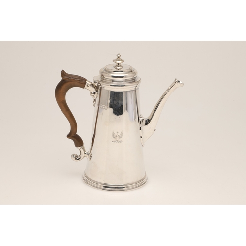 50 - A LATE VICTORIAN SILVER COFFEE POT. Of circular tapering form with carved fruitwood scroll handle an... 