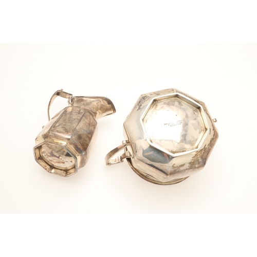 53 - AN EDWARDIAN SILVER FOUR PIECE OCTAGONAL FORM TEA SET. Comprising teapot and hot water/coffee pot, b... 