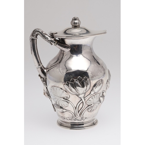 63 - A VICTORIAN SILVER WINE OR WATER JUG. The baluster body with repousse and chased decoration of water... 
