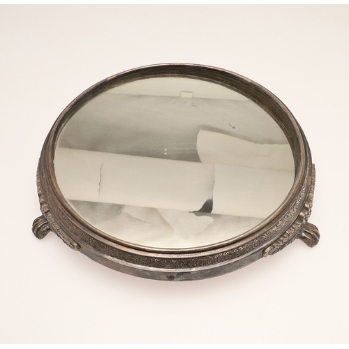 67 - A LATE VICTORIAN / EARLY EDWARDIAN SILVER MIRRORED CAKE STAND. Of circular form, the silver frame wi... 