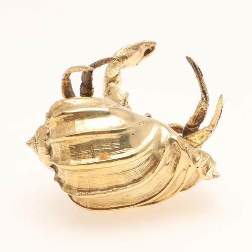 77 - A SILVER GILT HERMIT CRAB. Modelled with a shell resting on its back. 
Hallmarked Meiling & Gartrell... 