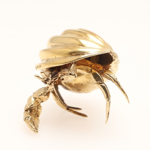 77 - A SILVER GILT HERMIT CRAB. Modelled with a shell resting on its back. 
Hallmarked Meiling & Gartrell... 