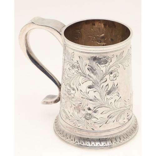 82 - A GEORGE III SILVER MUG. With later chased foliate and flower head decoration, hallmarked John Langl... 
