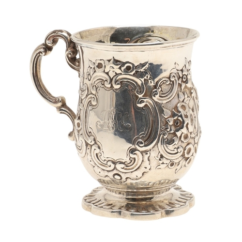 84 - A VICTORIAN SILVER ROCOCO DECORATED CHRISTENING MUG. Of baluster form, with floral and c-scroll deco... 
