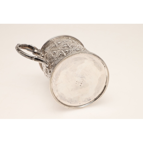 85 - A VICTORIAN SILVER JUG. Of rounded form, with repousse flowerhead decoration and scroll handle, heig... 