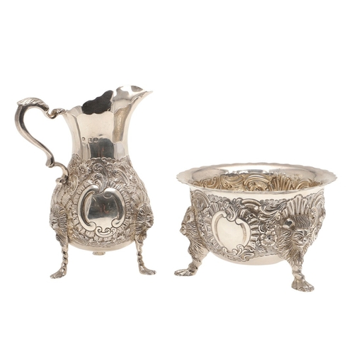 86 - A VICTORIAN GEORGE II STYLE IRISH SILVER CREAM JUG AND SUGAR BOWL. The jug and sugar bowl both with ... 
